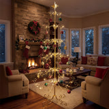 Gold scrollwork Christmas ornament stand with hanging baubles and star-topped spire