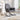 Grey upholstered rocking chair with headrest, wide armrests, and curved rocker base
