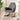 Grey rocking chair with headrest and deep seat cushion, black metal legs and rockers