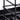 Black steel caddy frame with curved base support and wire shelf detail