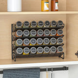 4-tier metal spice rack with spice jars in round labels, black wire shelves
