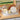 White iron dish drainer kitchen rack with plate slots and utensil holders