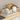 White dish drainer with wooden side handles and dividers for plates and bowls