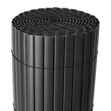 Black PVC privacy screen roll with vertical ribbed slat pattern