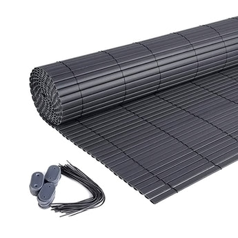 Dark gray PVC privacy screen sheet rolled out with square grid reinforcement