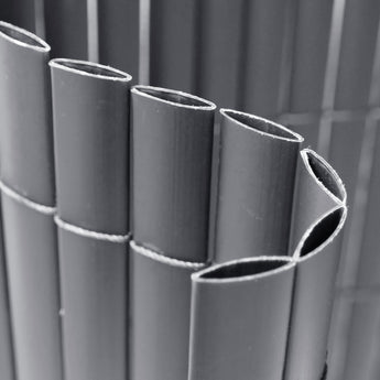 Rolled PVC privacy screen showing tightly wound vertical slats and ties