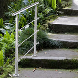 Silver stainless steel handrail on floor mounts with three horizontal grab bars
