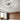 Semi-recessed LED ceiling luminaire with white U-shaped frames and four light sections