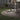 Metal parasol cross base with central pole, black steel frame