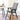 Outdoor mesh dining chair with dark frame and gray fabric seat