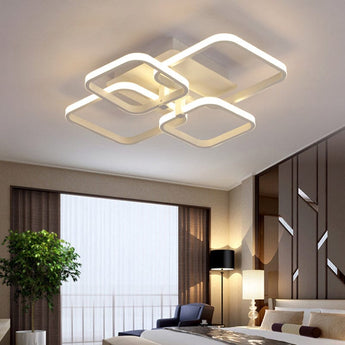 Adjustable semi-recessed LED ceiling fixture with four glowing square rings, white frame