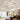 Adjustable semi-recessed LED ceiling fixture with four square light rings, white housing
