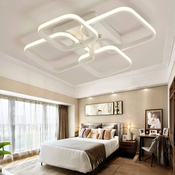 Adjustable semi-recessed LED ceiling fixture with four square light rings, white housing