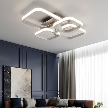 Adjustable semi-recessed LED ceiling fixture with four square rings and soft white glow