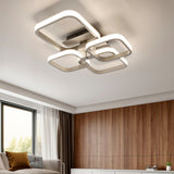 Adjustable semi-recessed LED ceiling fixture with four glowing square rings, white finish