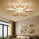 Modern LED semi-ceiling luminaire with five white petal rings in a floral star shape