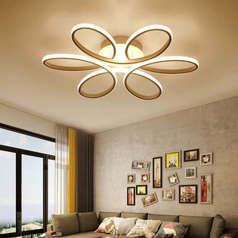 Modern LED semi-ceiling luminaire with five white petal rings in a floral star shape