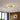 Gold 5-ring LED ceiling light with five circular loop frames and white inner glow
