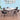 Outdoor patio dining set: white glass-top table with four mesh chairs
