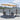 Outdoor dining table with 4 woven chairs and open umbrella over patio seating