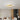 Golden LED semi-flush mount ceiling light with five connected ring shades, warm white