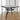 Metal square outdoor dining table side view with black top and curved metal base