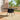 Black square outdoor table with center parasol hole and woven sides