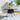 Black square outdoor table with center parasol hole and textured woven frame