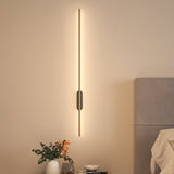 100cm LED strip wall lamp with gold vertical bar and oval wall mounting piece, lit