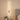 100cm LED strip wall lamp with gold vertical bar and oval wall mounting piece, lit