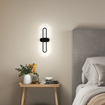 Schwarze LED-Wandleuchte mit ovaler Acryl-Abdeckung, warmweiße Beleuchtung