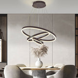 Black ring-shaped LED pendant light with circular glowing bands and hanging cords