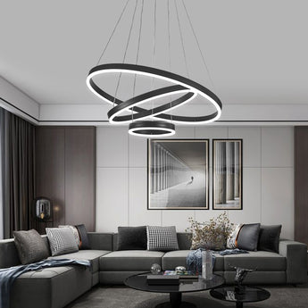 Black multi-ring LED pendant light with bright circular light rings on cords