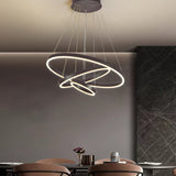 Black LED ring pendant light with two glowing circular rings and hanging cords
