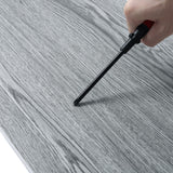Textured grey PVC wood plank surface close-up with wood-grain detail