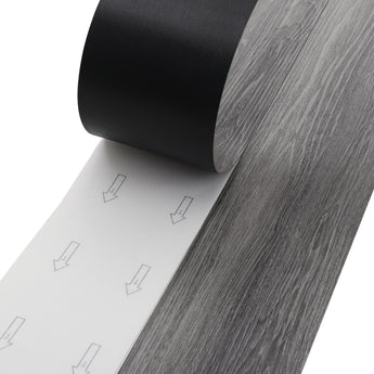 Self-adhesive PVC laminate plank with dark grey woodgrain pattern