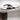 Modern LED ceiling light with black central star discs and chrome-like circular rings