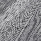 Grey wood-effect grain close-up on smooth PVC flooring