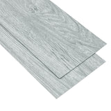 Gray wood-effect PVC flooring tile with edge alignment seam and layered plank look