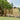 Wood fence gate with horizontal slat fencing and vertical support posts