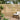 Light wood fence gate panel with horizontal slats and solid side frame