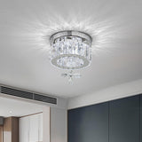 Round crystal LED ceiling light with chrome trim and dangling clear crystal pendant