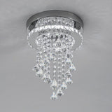 Close-up crystal ceiling light with chrome ring and clear faceted droplet strands