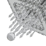 Close-up: faceted crystal droplets and prisms under a square frame