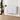 White aluminium panel electric wall heater mounted on a wall, ribbed design.