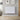 White aluminium panel electric wall heater with rectangular ribbed panels.