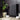 Dark gray electric ceramic wall heater with vertical ribbed radiator front