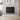 Wall-mounted electric panel heater with vertical fins, dark gray, rectangular design