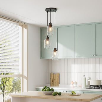 Black 3-light pendant light with three clear wave glass lamp shades on hanging cords