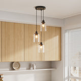 Black 3-light pendant light with three clear wave glass shades and black ceiling mount